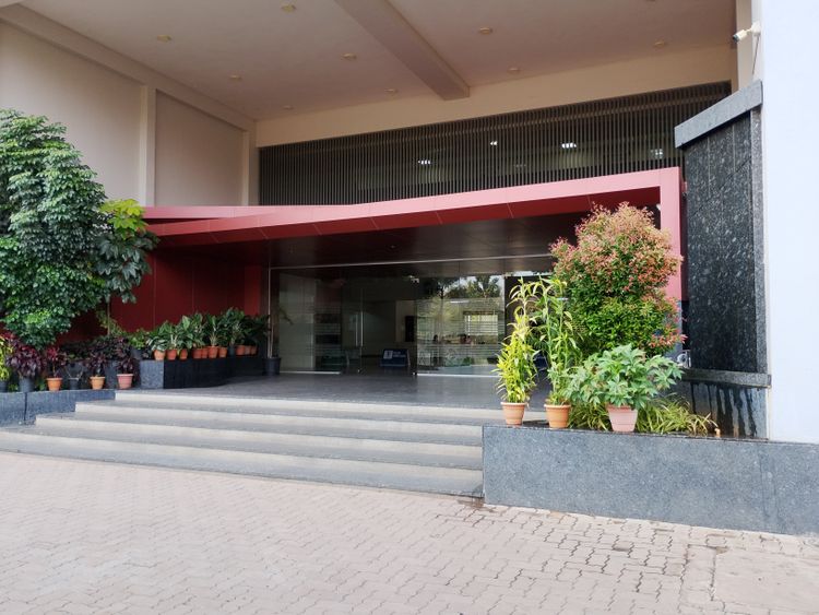 Illustrative modern commercial building entrance with canopy