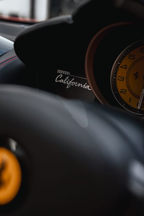Free Close-up shot of Ferrari California interior highlighting the speedometer and luxurious details. Stock Photo