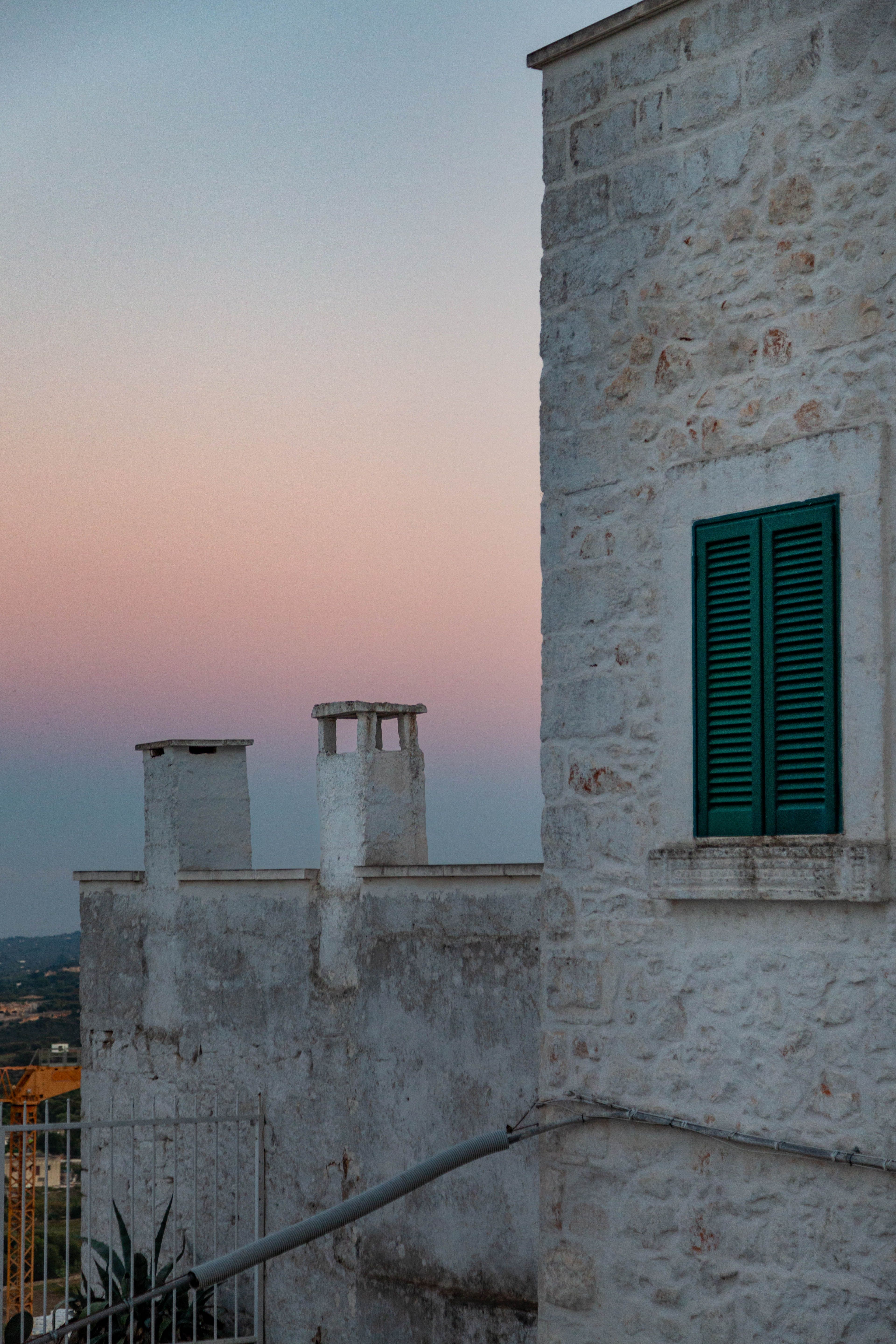Capture of historic stone buildings in Bari during a beautiful sunset.