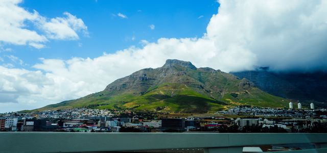 Stunning landscape of Cape Town's iconic Table Mountain under a bright blue sky.
