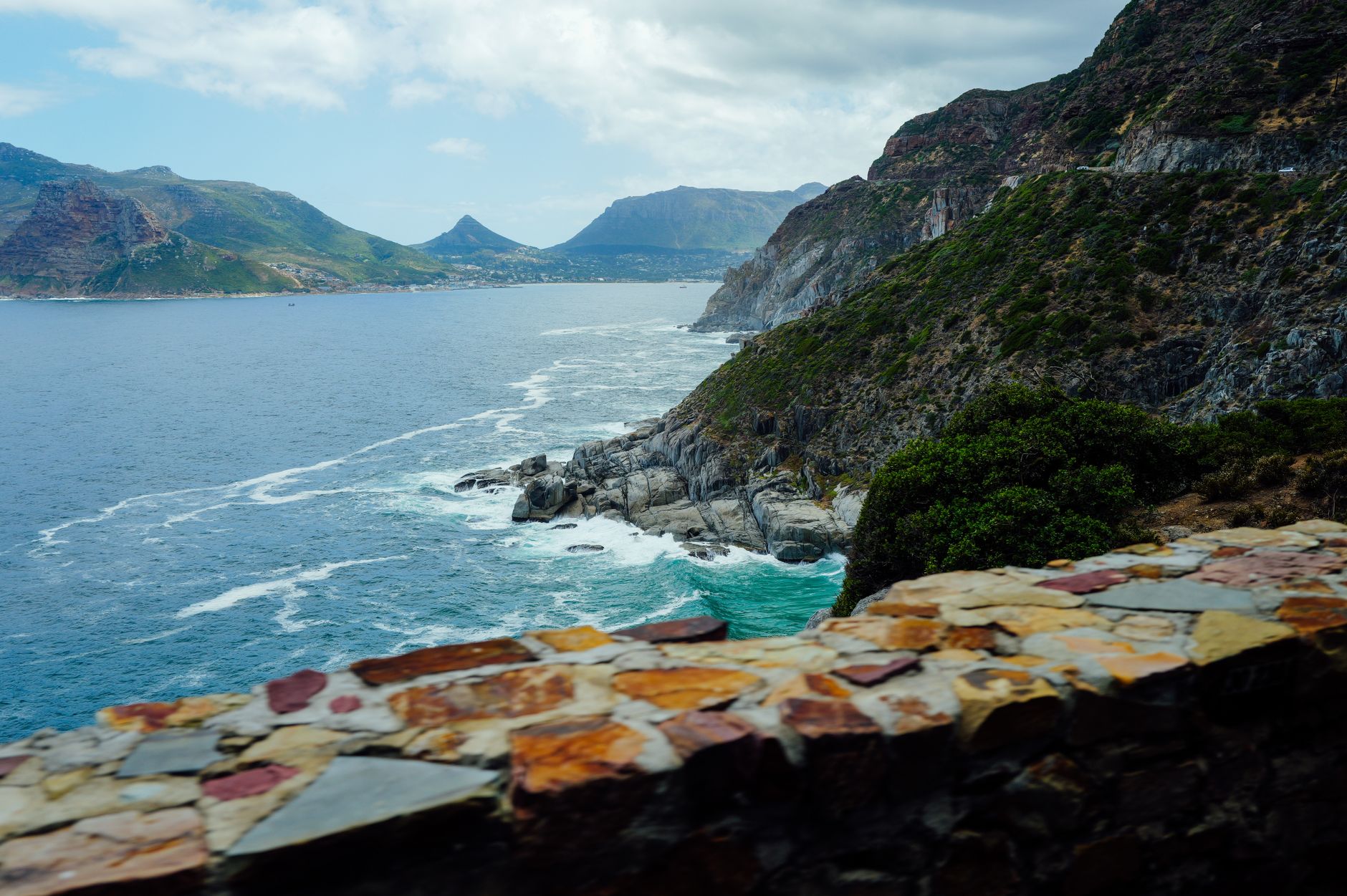 Breathtaking view of mountains and ocean from Chapman's Peak Drive in Cape Town.