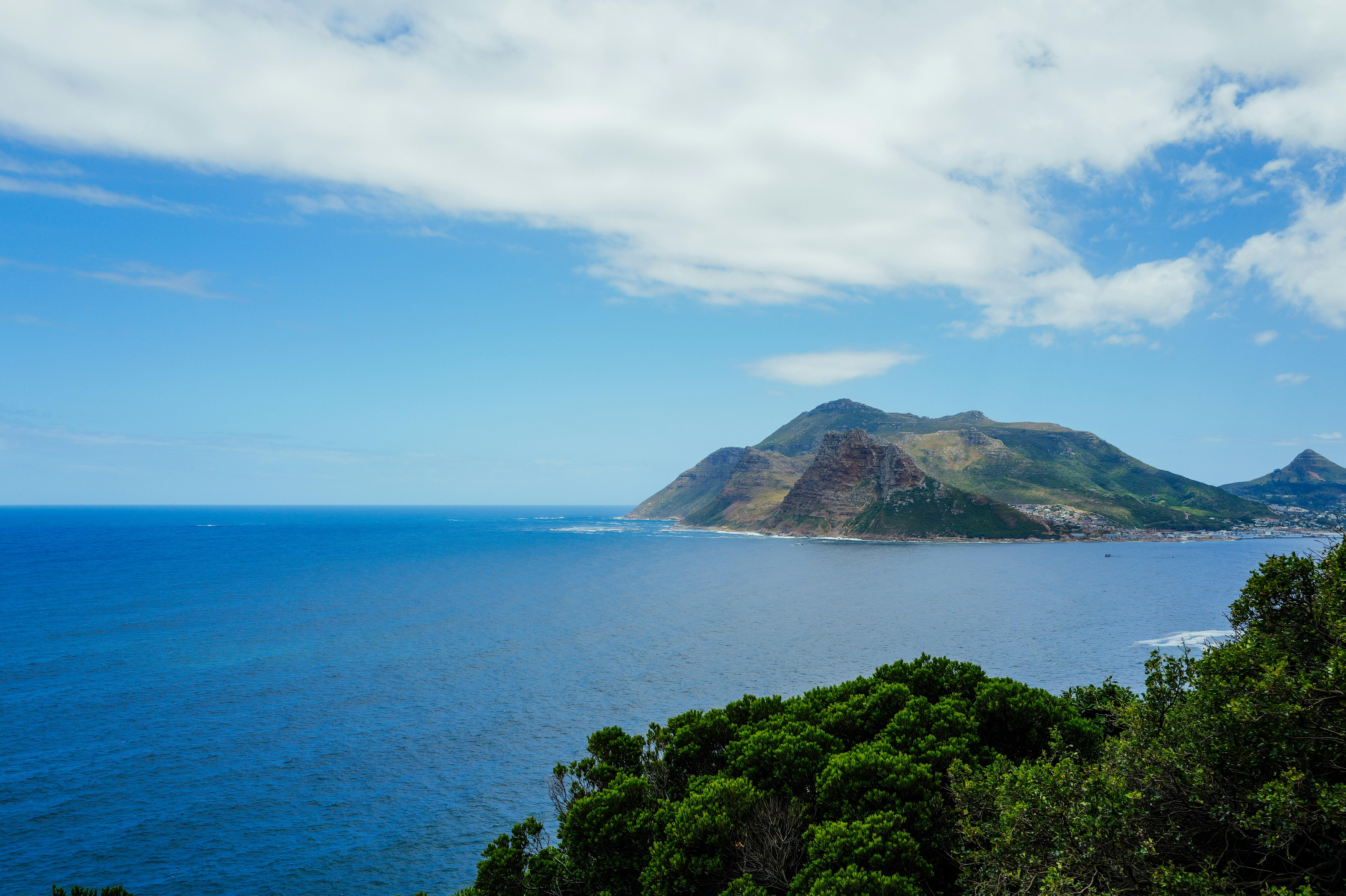 Stunning landscape view of Cape of Good Hope with clear blue waters and lush greenery.