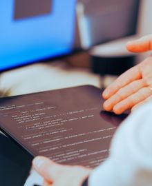 Engineer reviewing code during a quality review