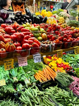 Fresh vegetables and fruits at an Italian market stall in Bologna, capturing the essence of local produce.