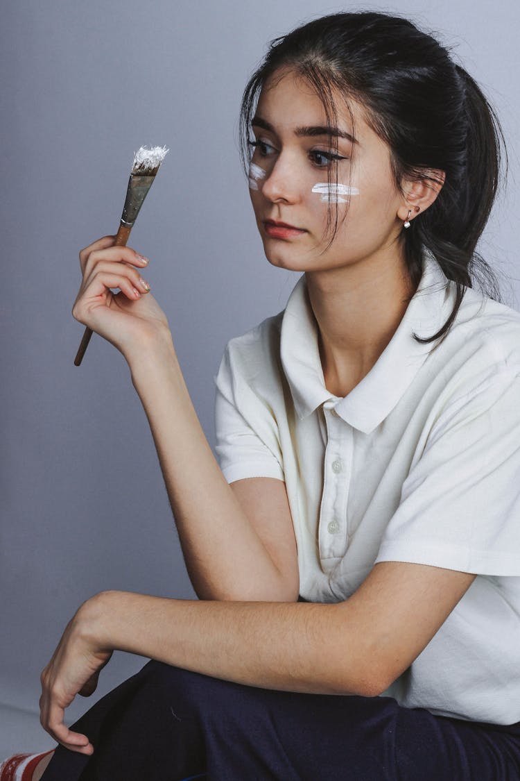 Woman In White Button Up Shirt Holding Paint Brush