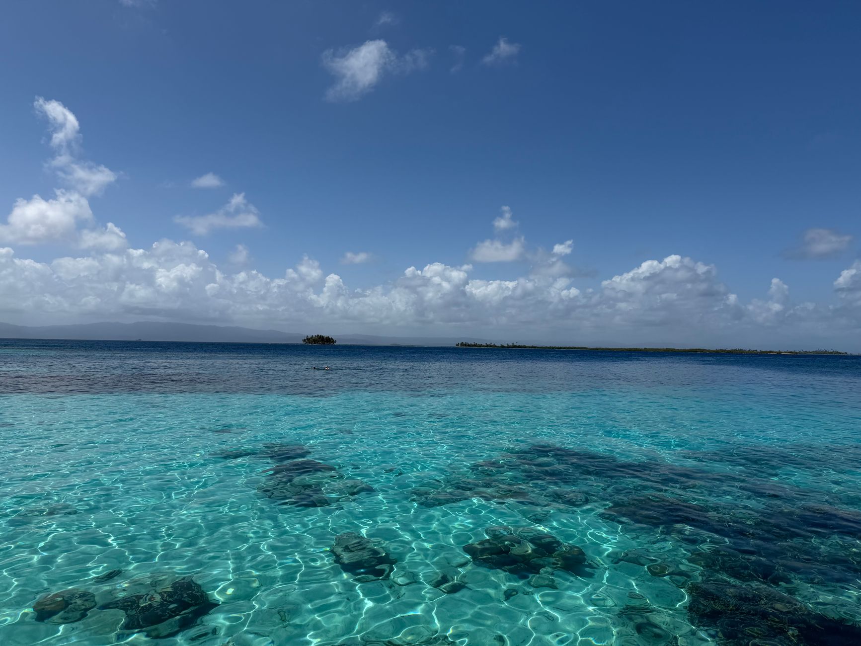 Crystal-clear turquoise waters of Guna Yala, Panama — the pristine Caribbean coastline that represents the country's most protected natural marine environment.