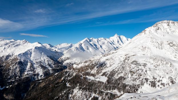 A breathtaking aerial view of the snow-covered mountains in Korutany, Austria during winter.