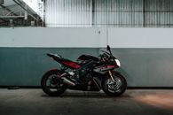 Photo of Parked Black and Red Triumph Daytona Sports Bike