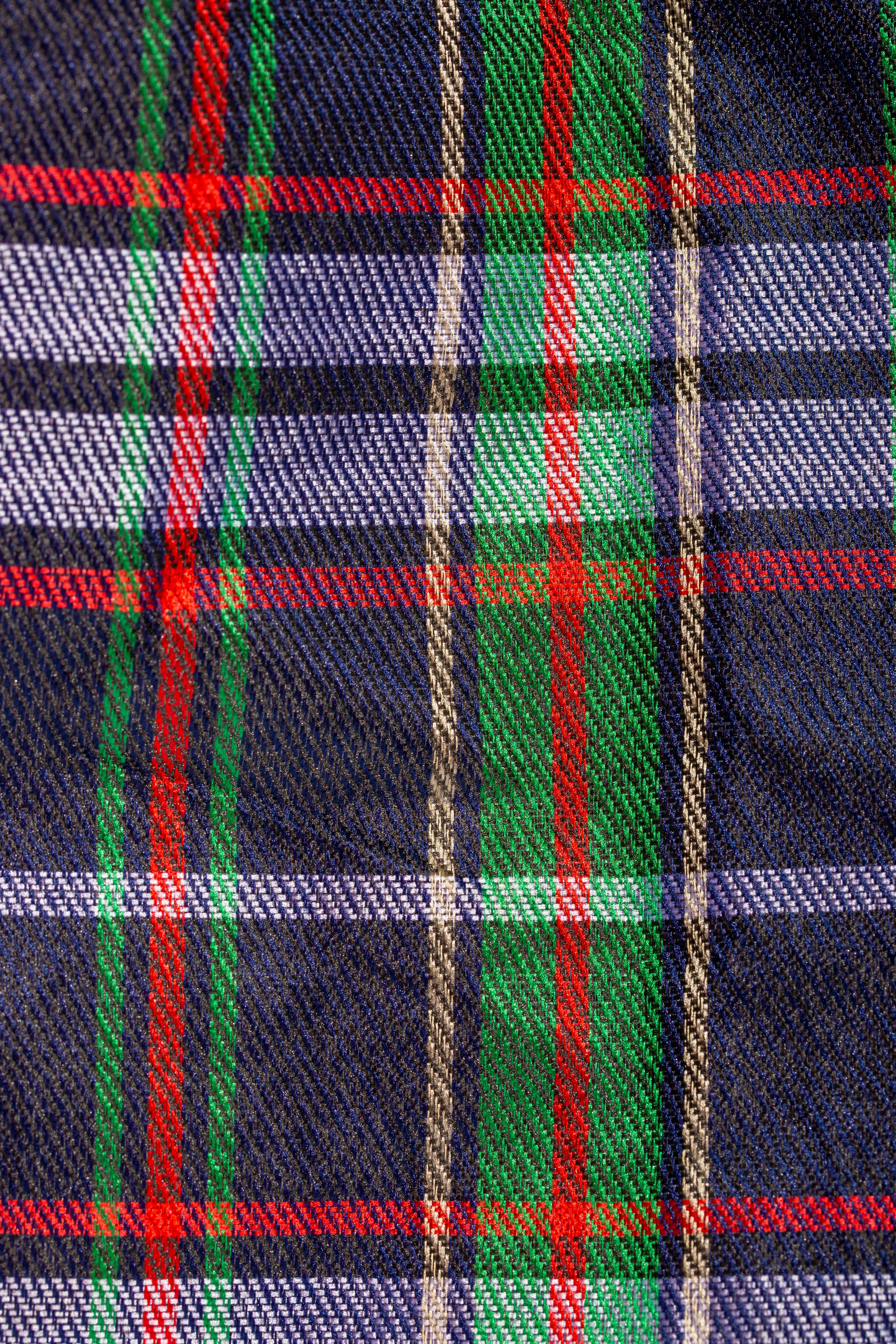 ฟรี ภาพระยะใกล้ของผ้าลายตารางหมากรุกสีสันสดใส เผยให้เห็นลวดลายการทอและพื้นผิวที่ละเอียดประณีต คลังภาพถ่าย