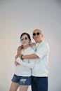 Fashionable Couple in Sunglasses Embracing