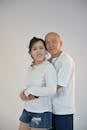 Smiling Couple in Casual White Outfits Portrait