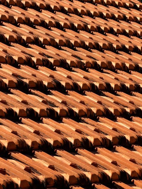 Close-up view of terracotta roof tiles creating a pattern in Ho Chi Minh City.