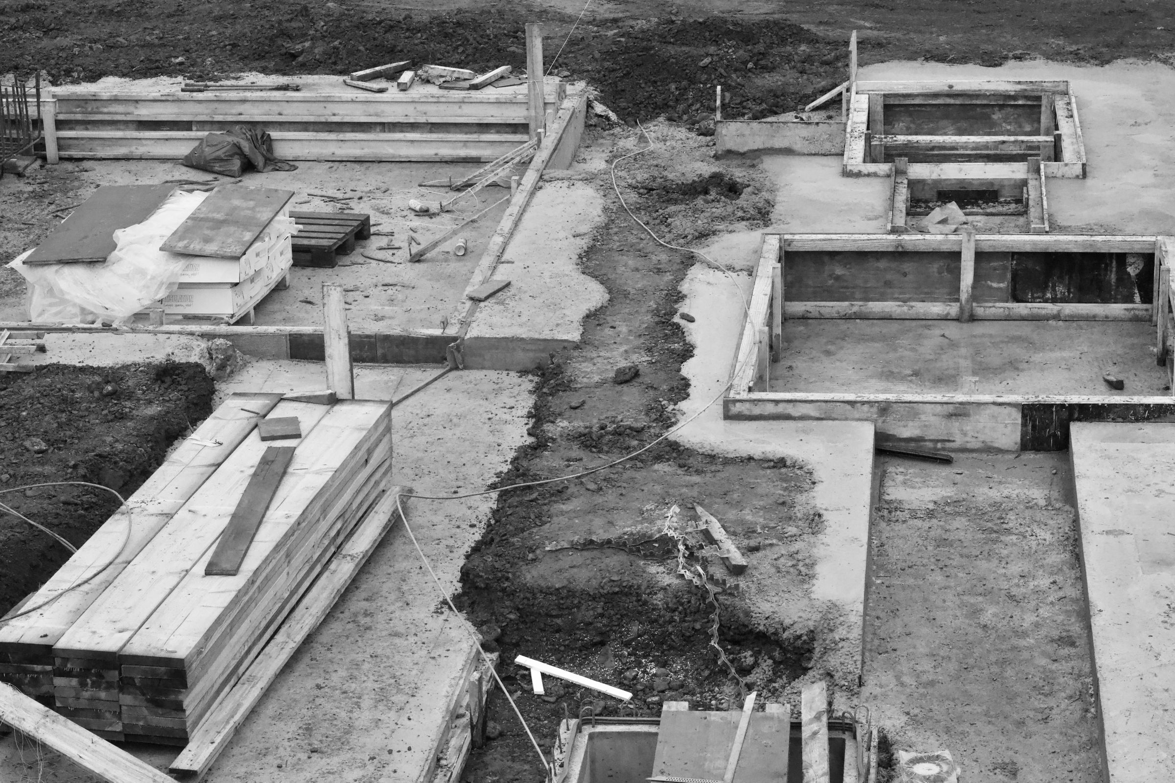 Aerial view of concrete foundations across a large construction site