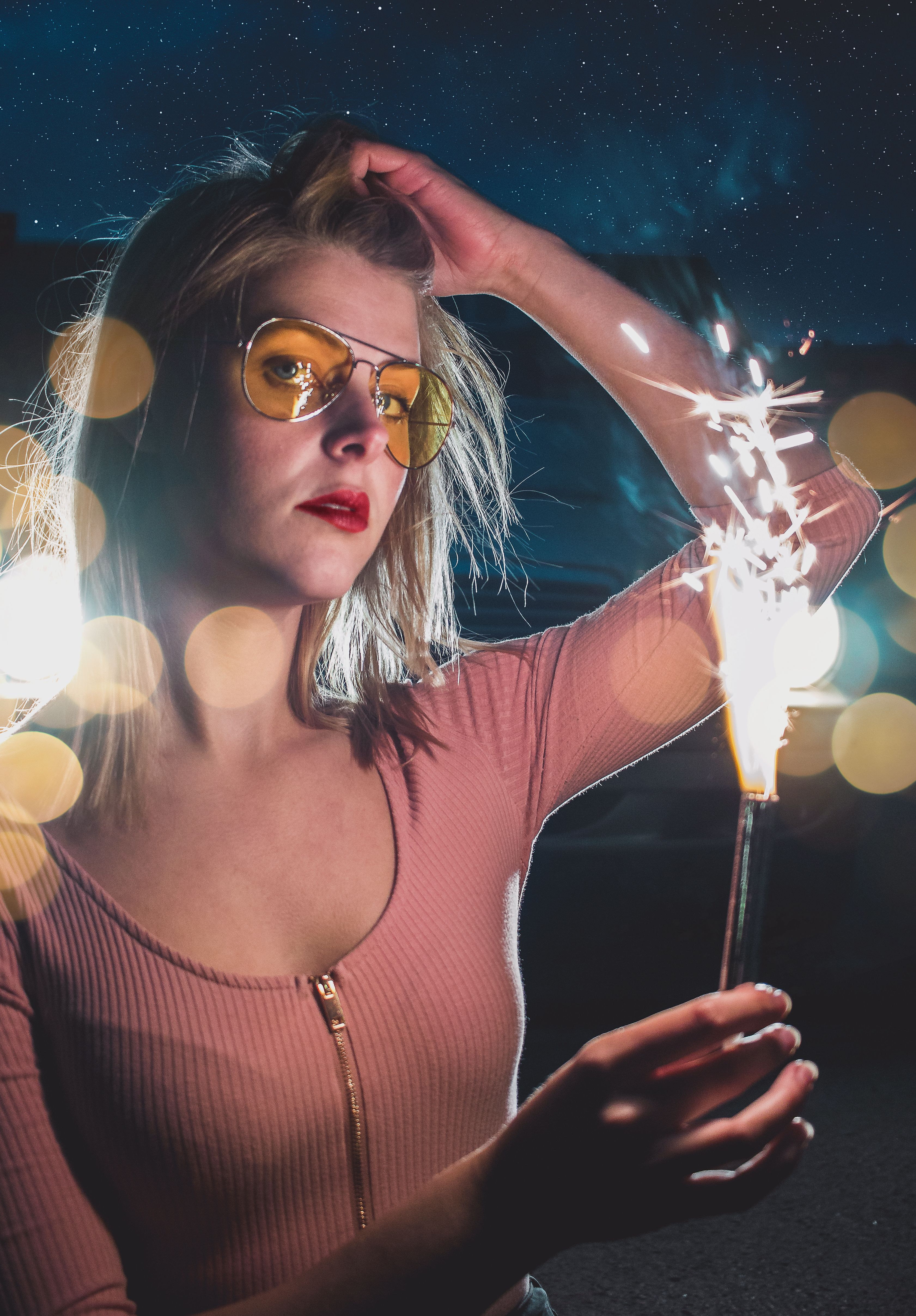Woman Holding a Sparkler · Free Stock Photo