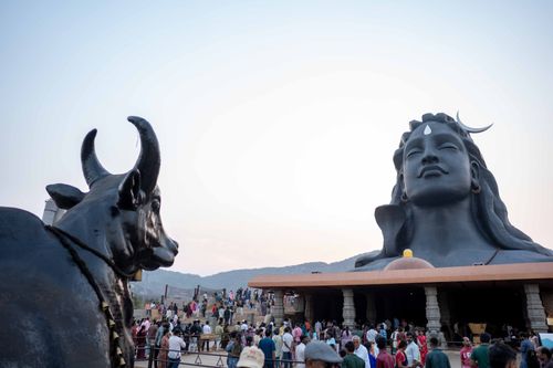 Free A striking view of the Adiyogi Shiva statue with crowds at Isha Yoga Center, captured at sunrise. Stock Photo
