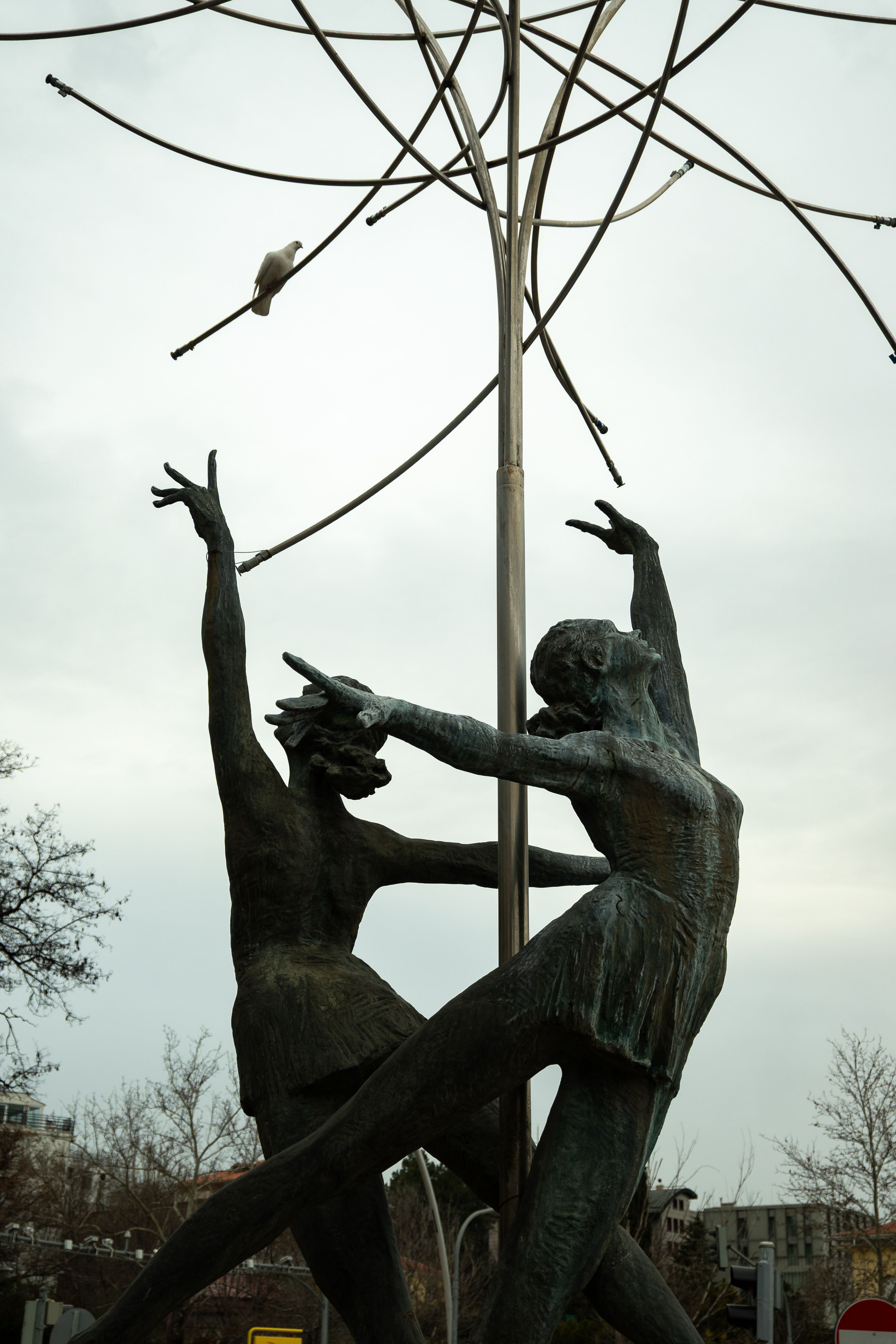 Artistic Sculpture of Dancing Figures Outdoors · Free Stock Photo