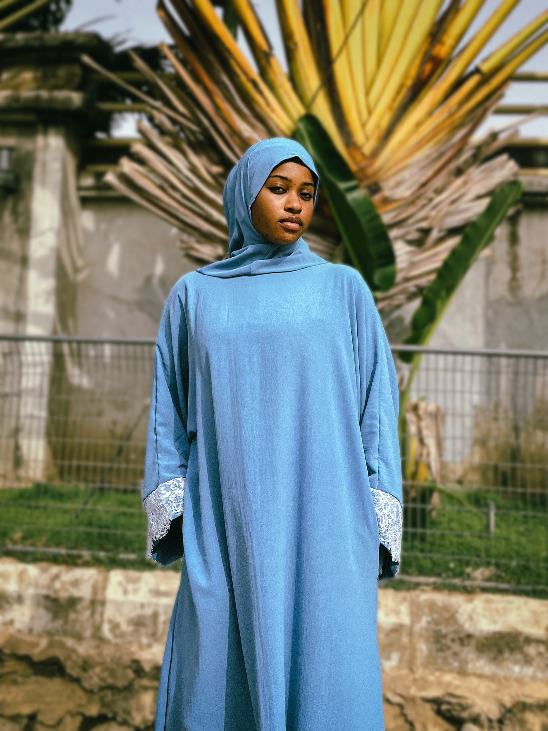 Portrait of Woman in Blue Hijab Outdoors · Free Stock Photo