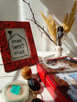 Warm home decor featuring a framed quote and natural elements in sunlight.