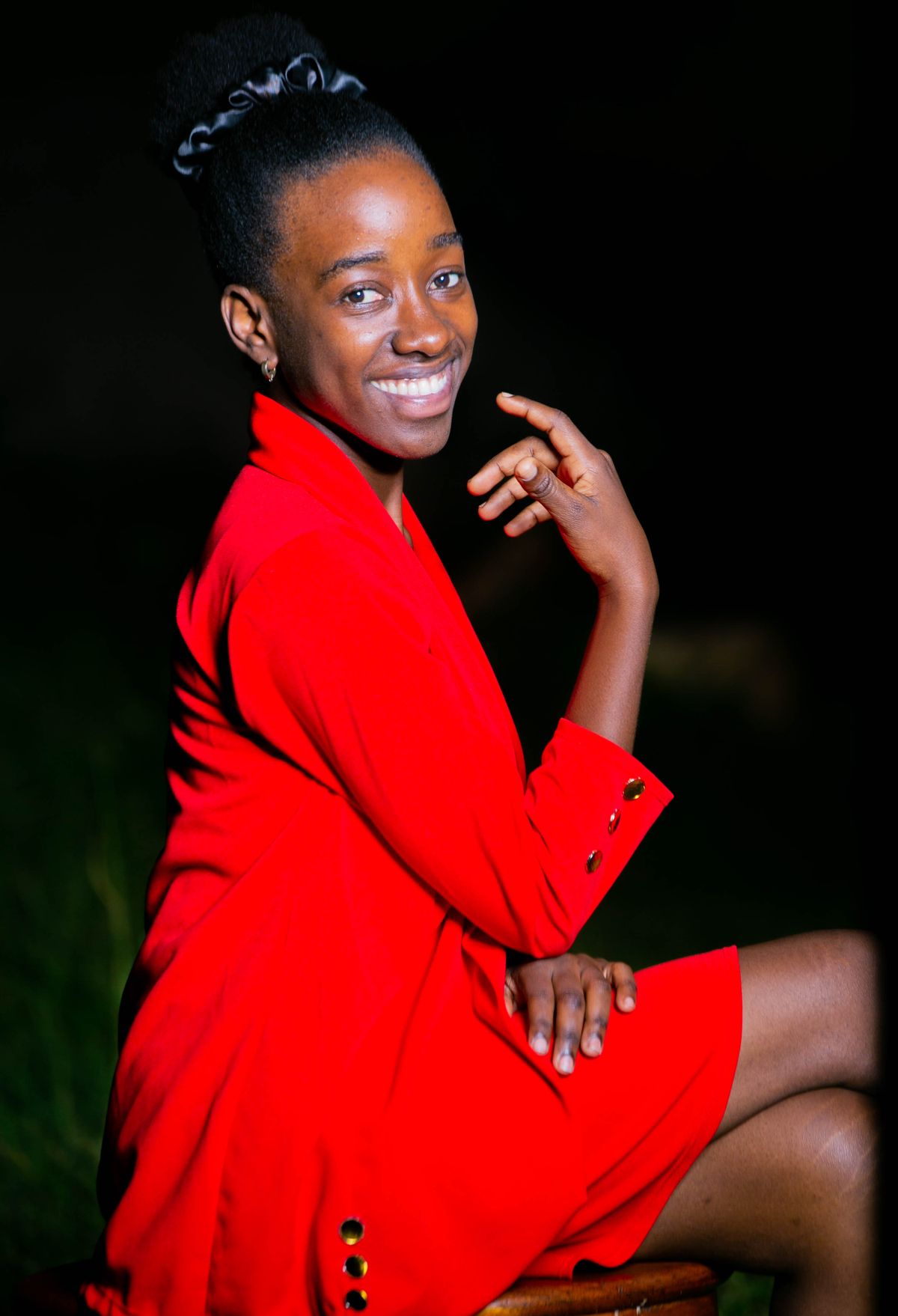 Elegant Woman in Red Dress Sitting on Bench Outdoors · Free Stock Photo
