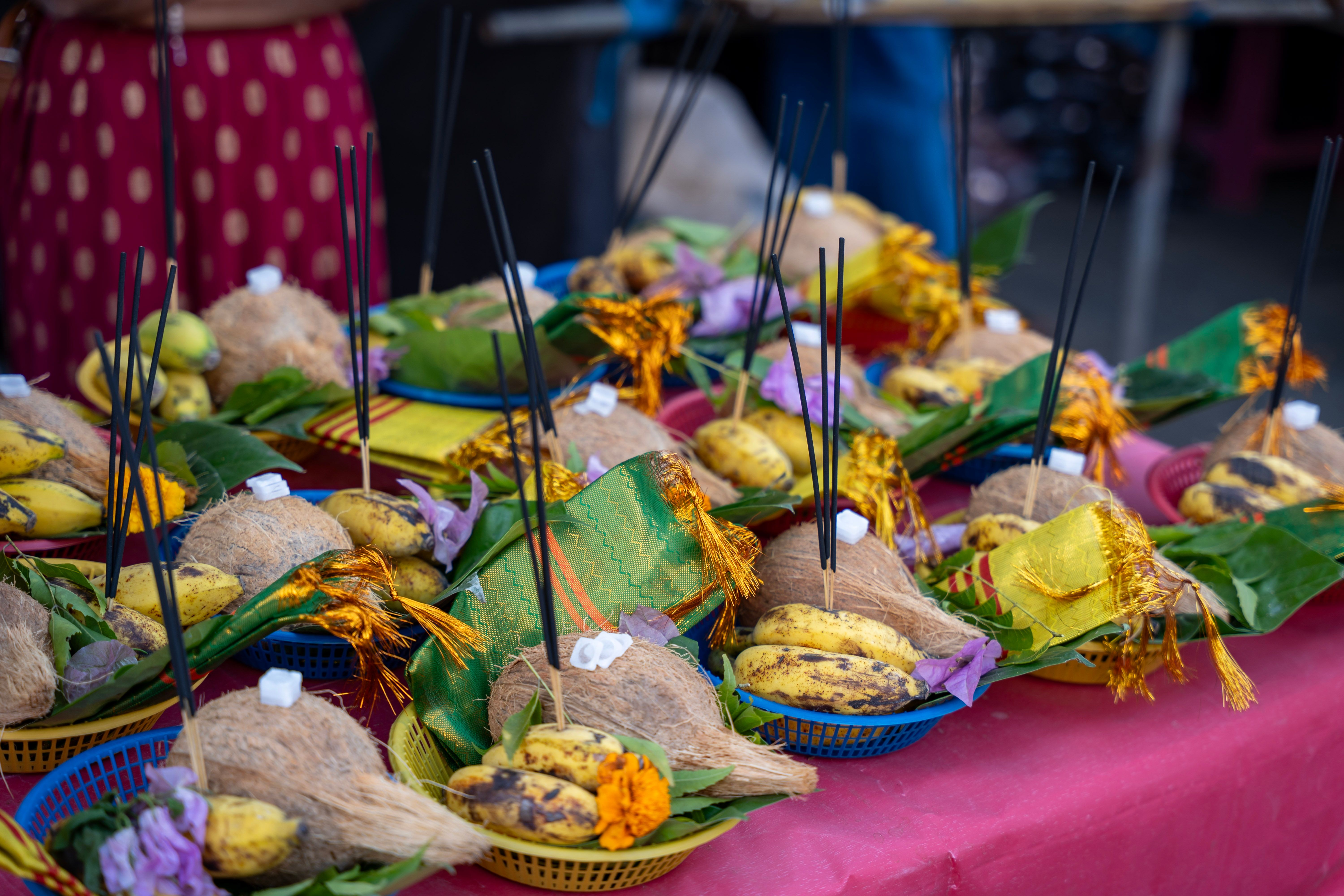 Vibrant festival baskets with coconuts and bananas, symbolizing Hindu rituals and cultural offerings.
