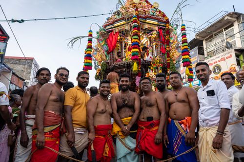 Free Colorful Hindu festival procession with a decorated chariot and attendees in traditional attire in Sri Lanka. Stock Photo