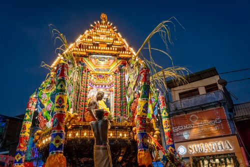 Free Colorful procession celebrating a Hindu festival at night under the starry sky. Stock Photo