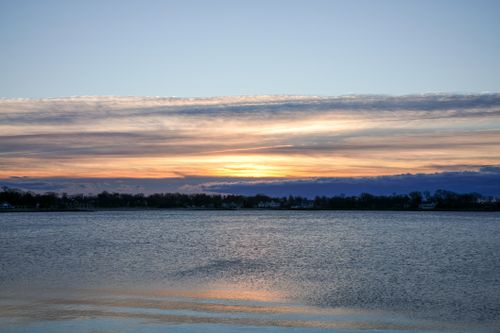 Free Peaceful twilight scene with a serene lake and vibrant sky reflections. Stock Photo