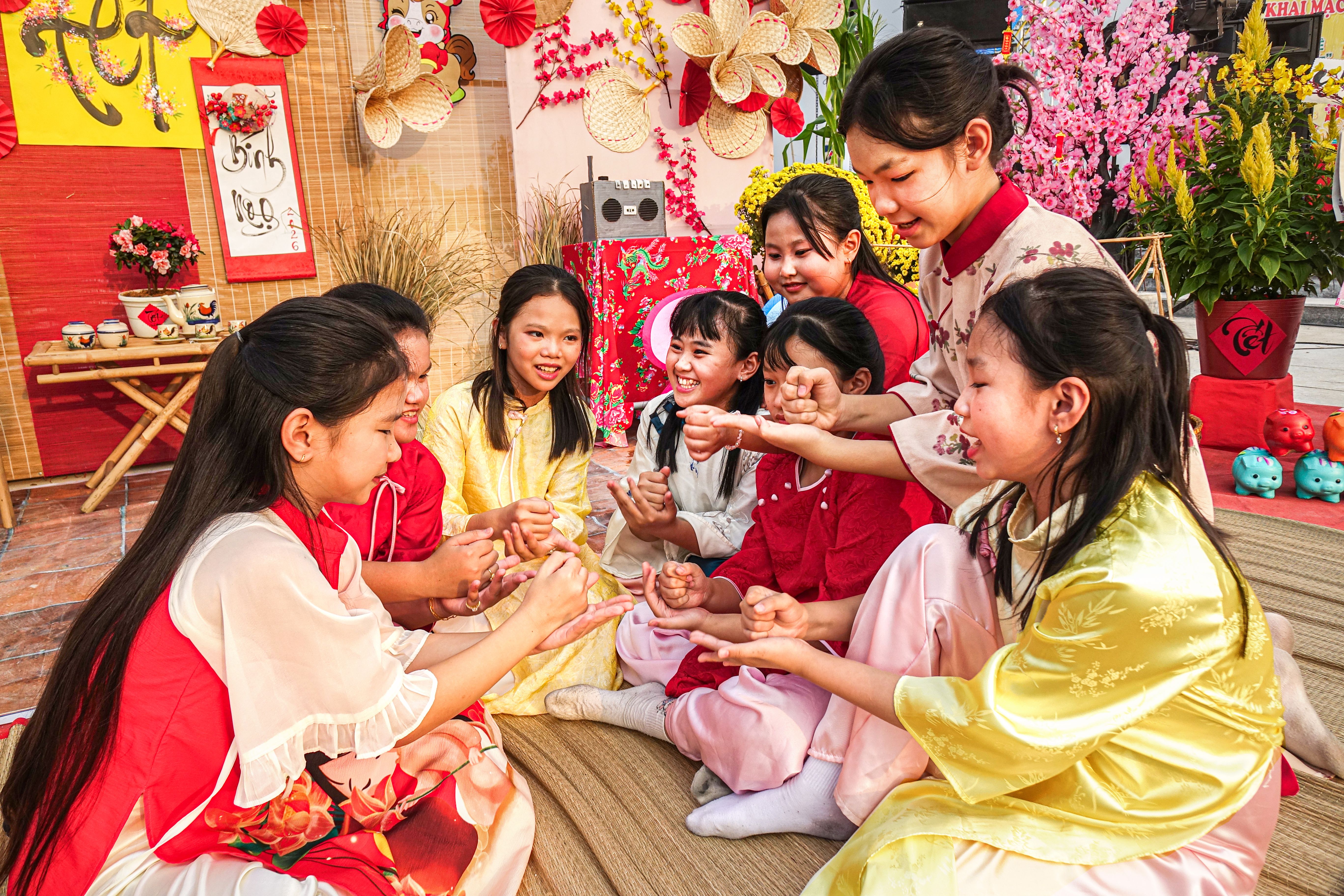 Children Celebrating Lunar New Year in Traditional Attire  Free Stock Photo