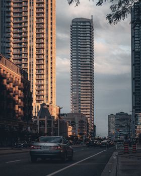 Dramatic cityscape of Mississauga, Ontario with modern skyscrapers during twilight.