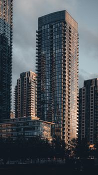 High-rise buildings in Mississauga, Ontario, during twilight with dramatic skies.