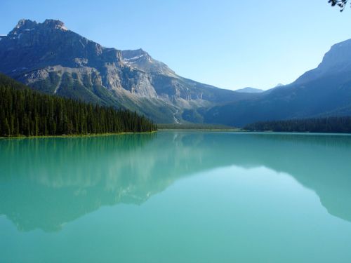 Free Stunning view of Emerald Lake in the Canadian Rockies, reflecting towering mountains. Stock Photo