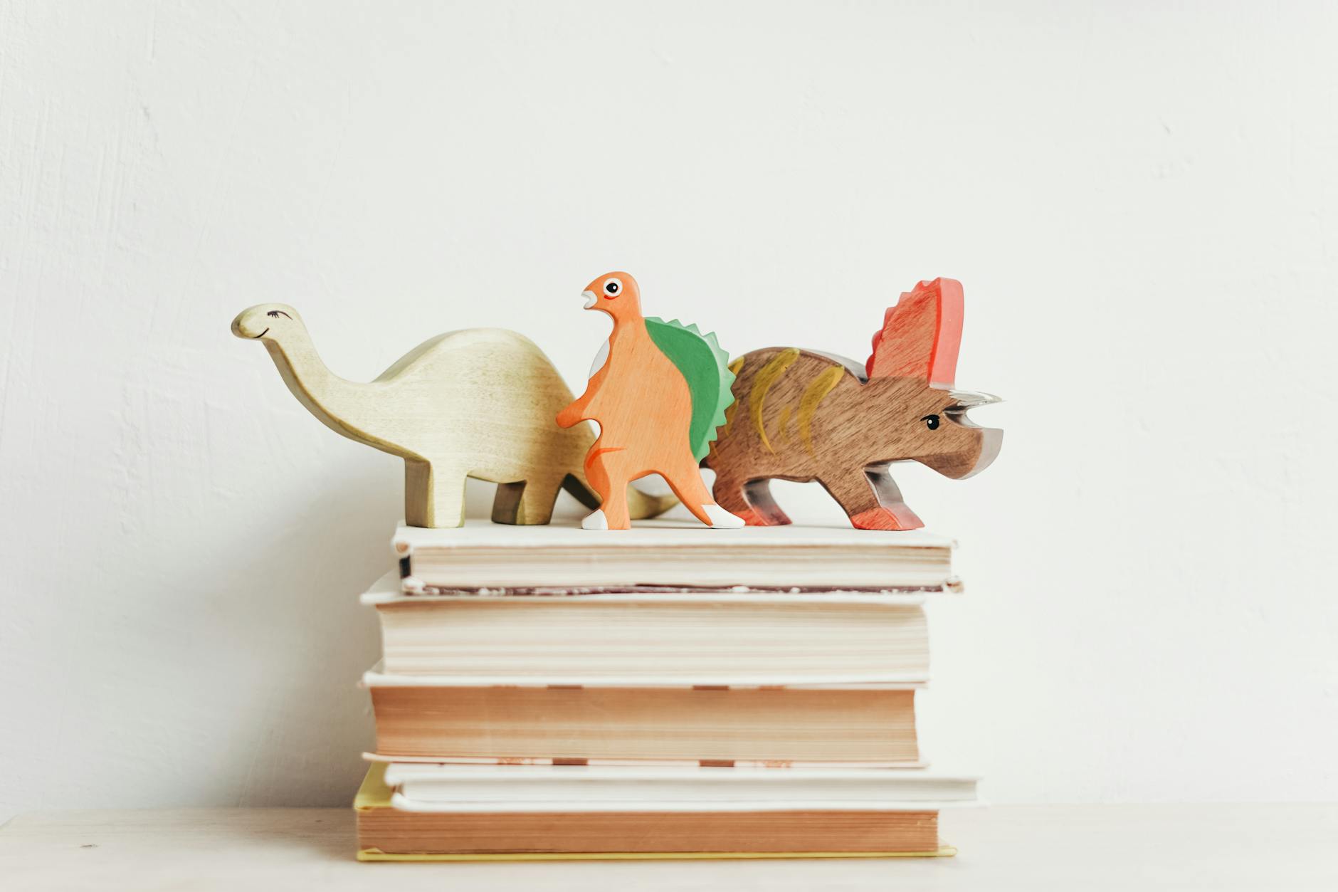 Three Wooden Dinosaur Books