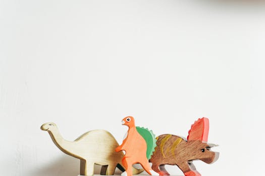 Three wooden dinosaur toys on a white background showcasing playful creativity.