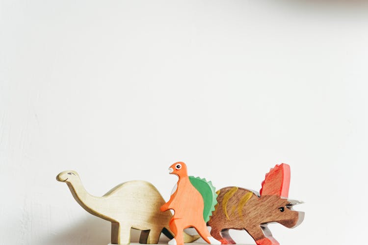 Wooden Dinosaur In White Backgroud