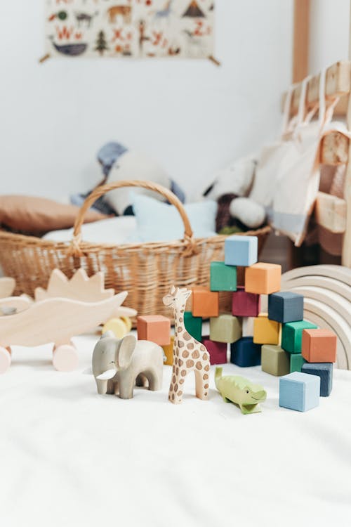 Brown Wicker Basket Near Colorful Blocks