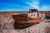 Rusting Ship in Aral Sea Desert Landscape