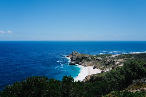 Free Breathtaking view of Cape Point coastline with azure ocean and cliffs under clear blue sky. Stock Photo