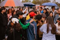 Emotional Gathering in the Rain with Umbrellas
