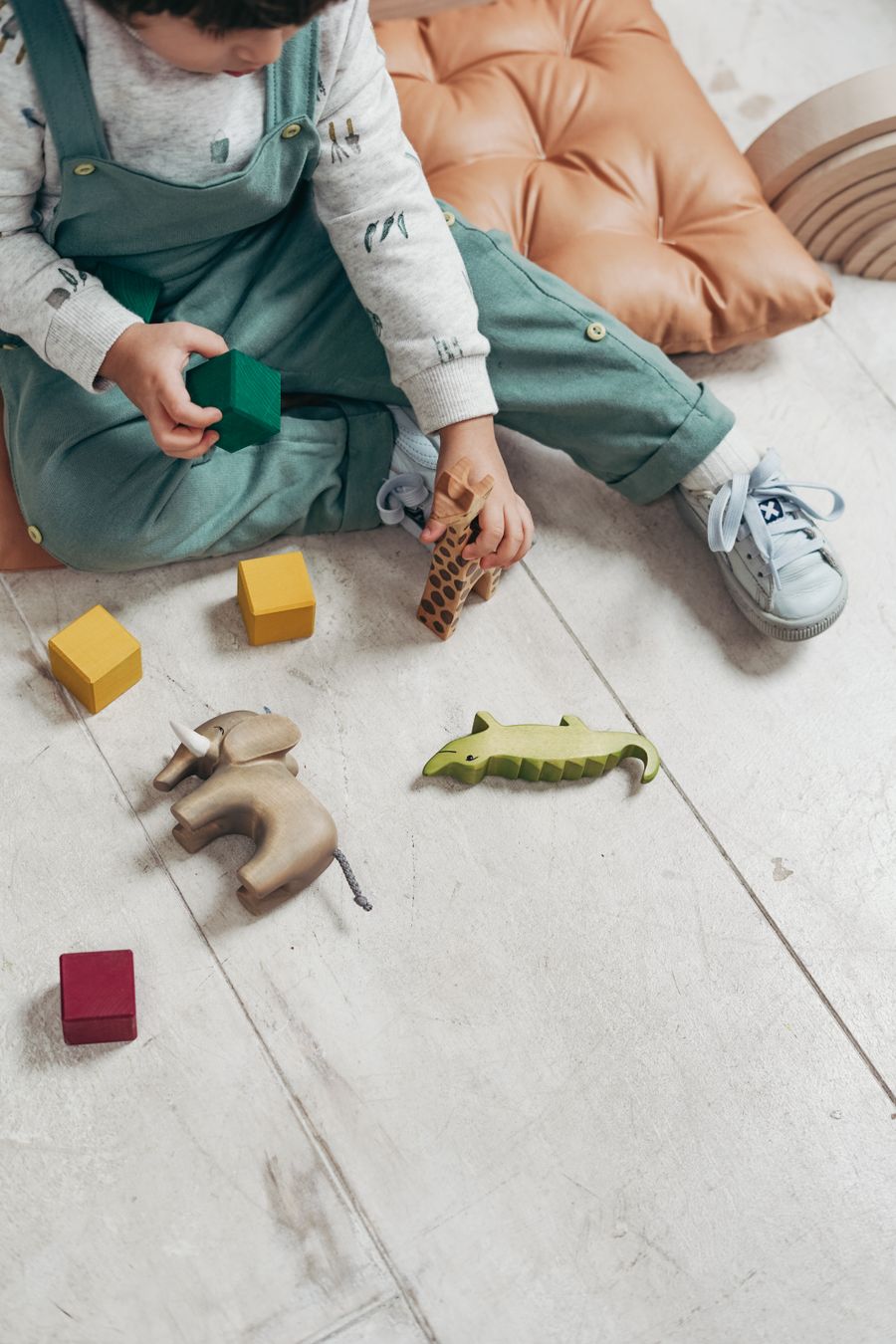 A young child playing with toys during developmental observation