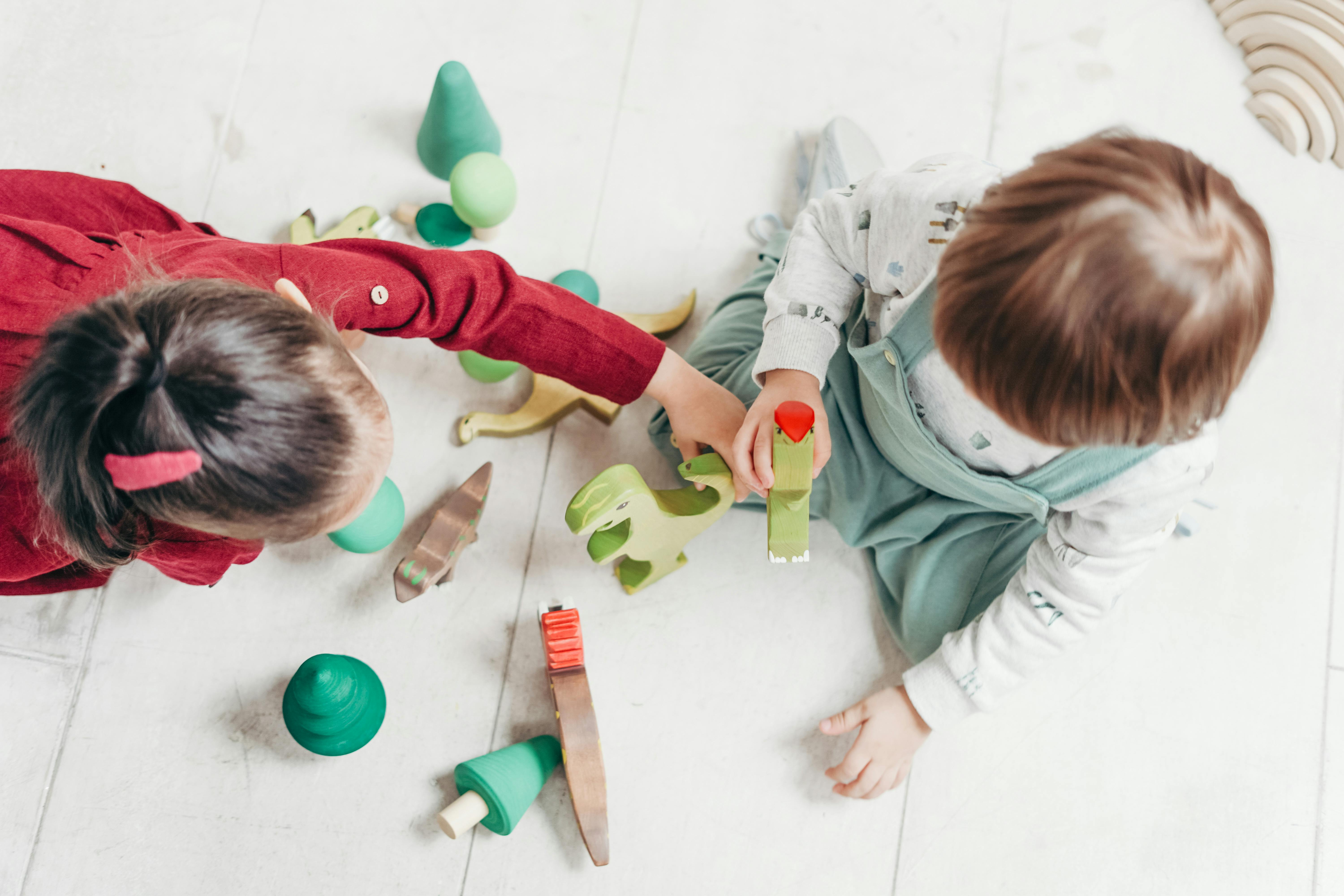 Children Playing With Animal Toys Free Stock Photo