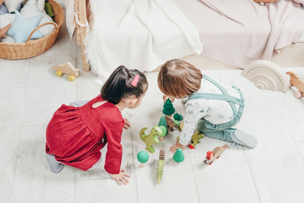 Children playing with wooden toys