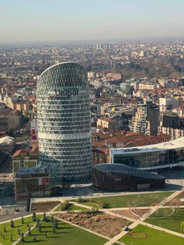 Aerial view of Unipol Tower in Milan, showcasing modern architecture and cityscape.