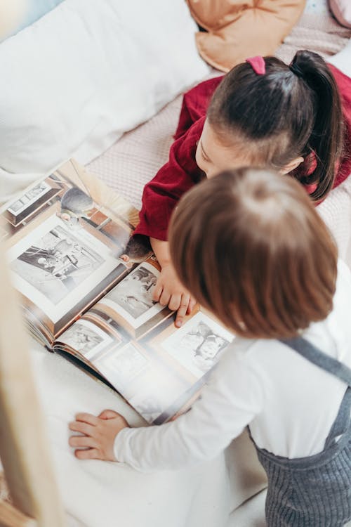 Free kids reading a book Stock Photo