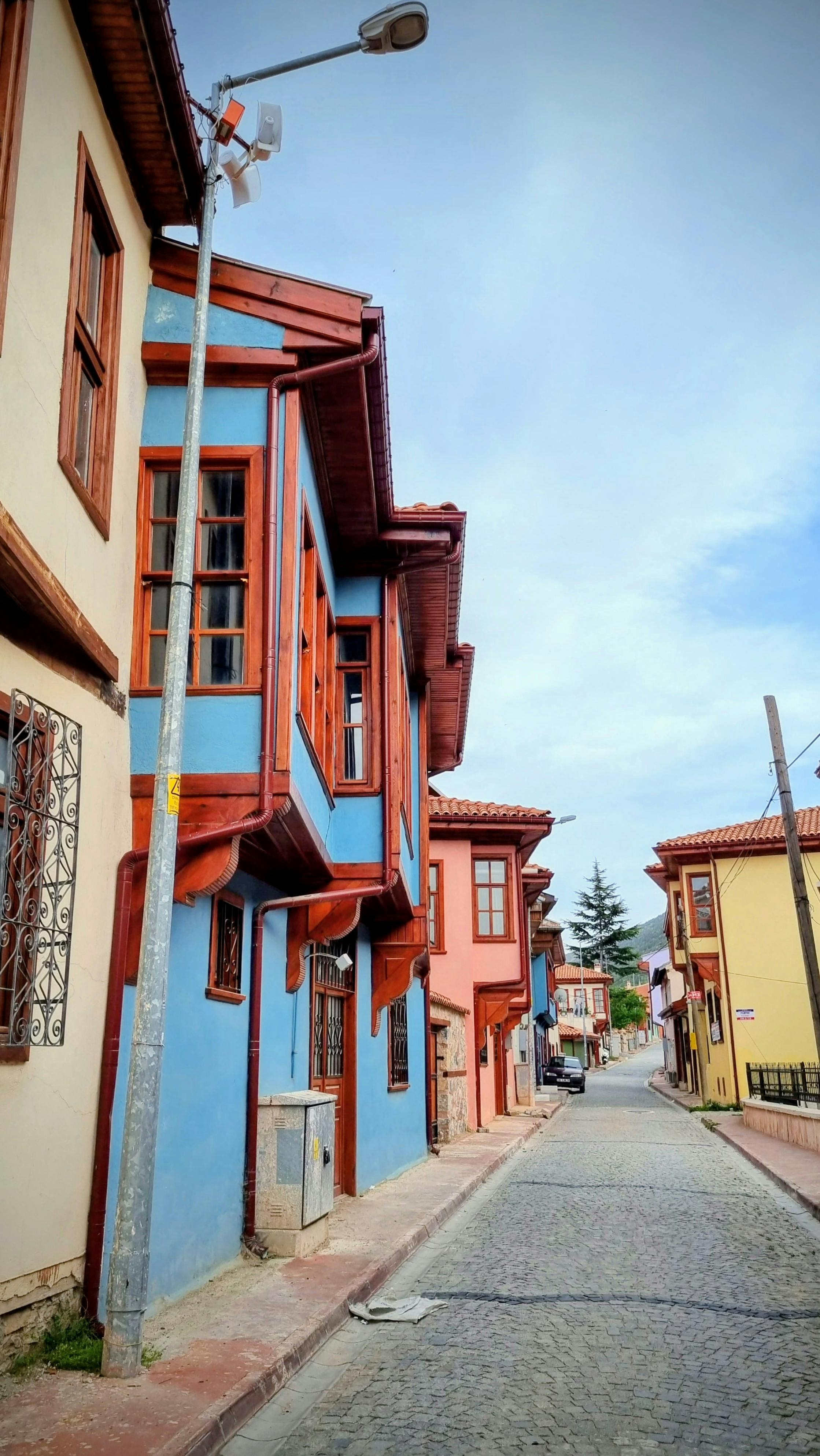 Vibrant Ottoman-era architecture along a cobblestone street, Turkey.