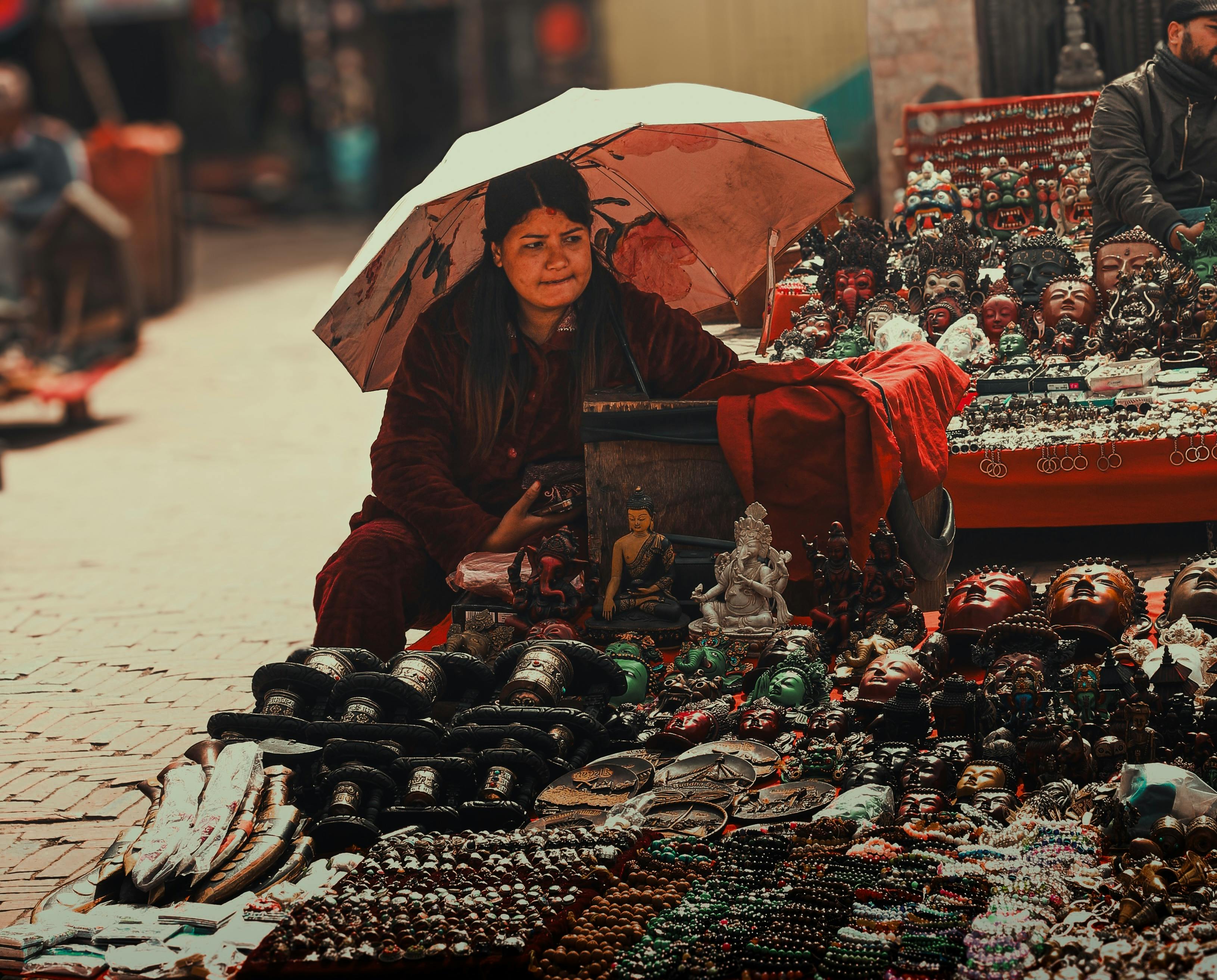 authentic tibetan bracelet - A woman sells traditional handicrafts at an outdoor market in Kathmandu, Nepal, showcasing vibr…