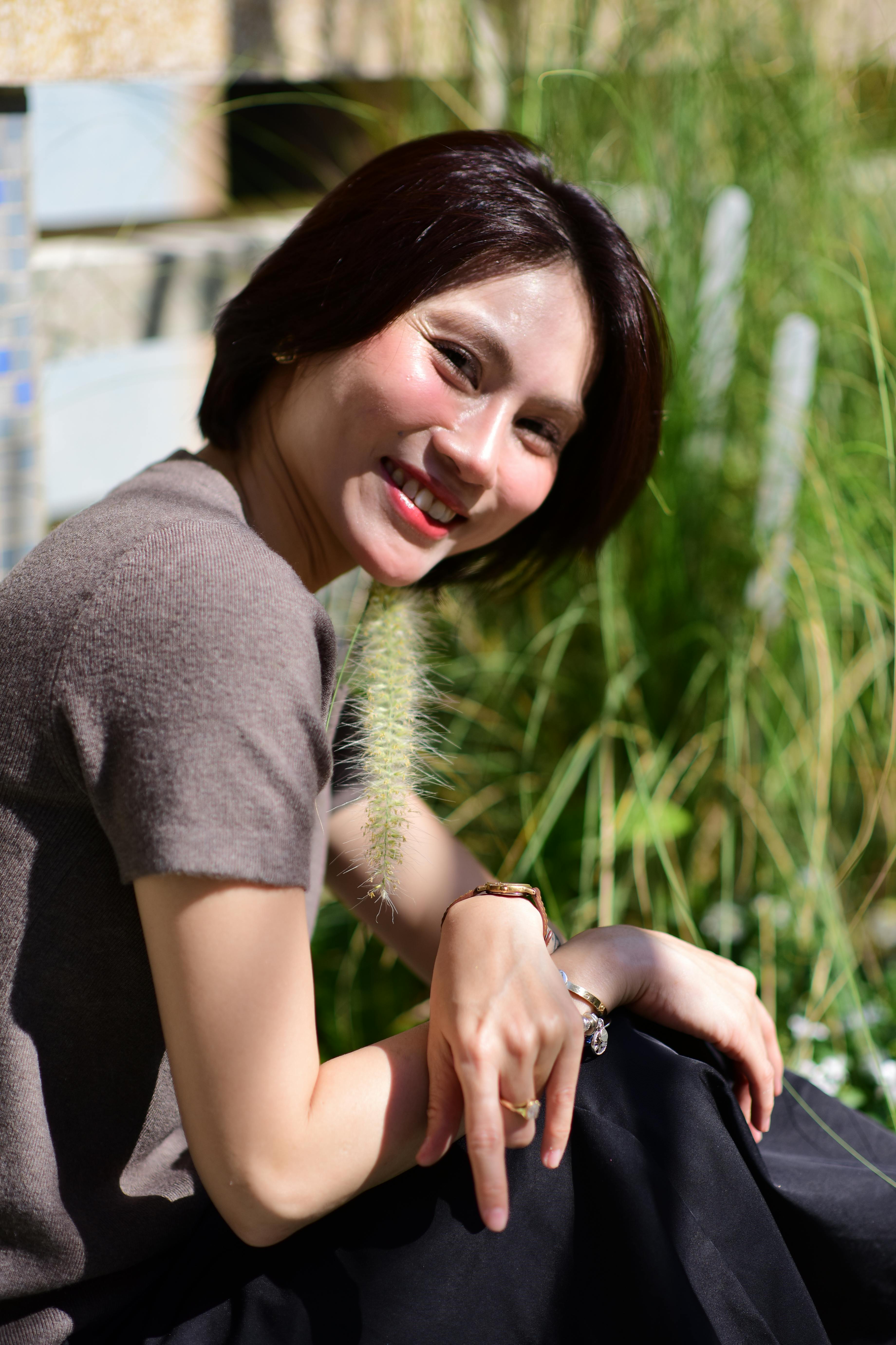 Smiling Woman Enjoying Sunny Day Outdoors