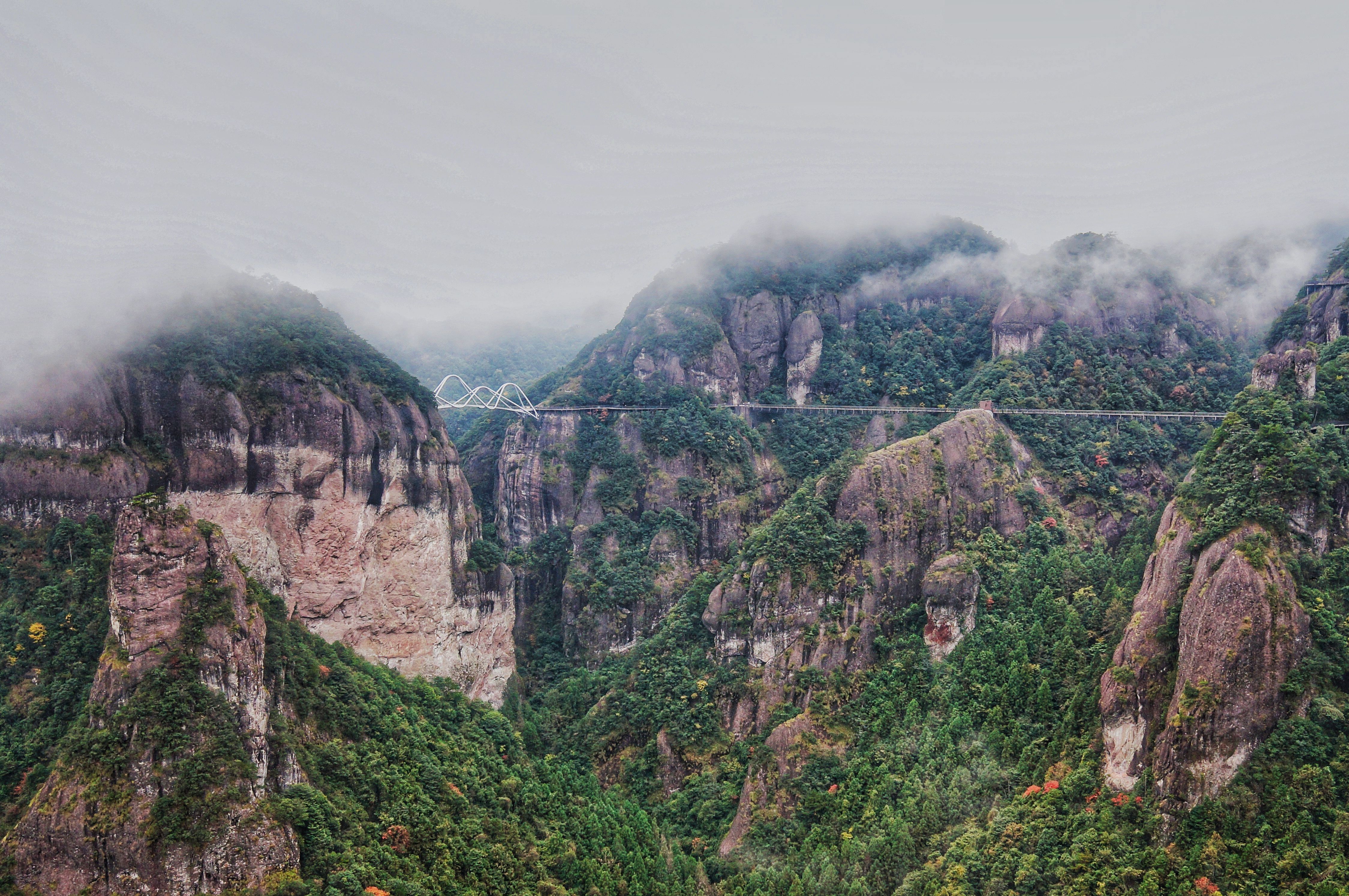 Misty Mountain Valley with Majestic Bridge · Free Stock Photo