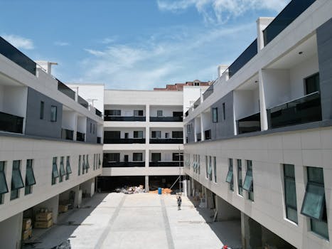 Daytime view of a modern apartment complex under construction, showcasing sleek design and architecture in Lagos, Nigeria.