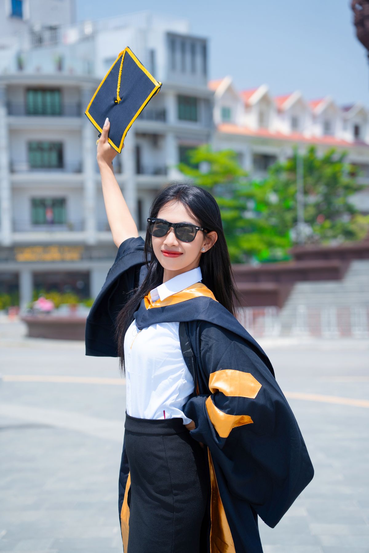 Hashtag Graduated Group of Graduates Celebrating Outdoors · Free Stock Photo