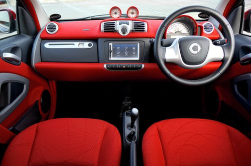 Free Explore the sleek design and vibrant red tones in this modern car interior shot. Stock Photo